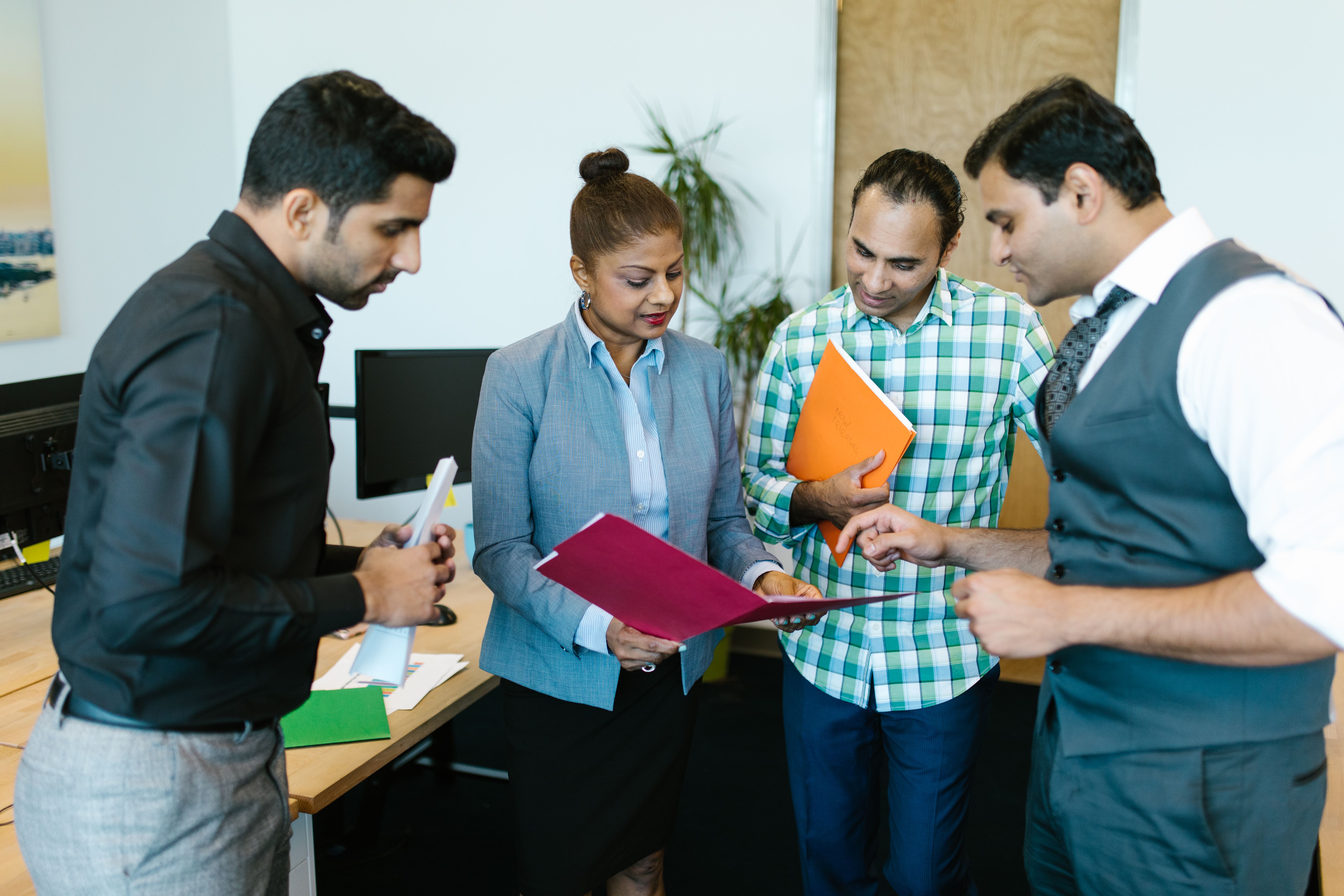 Operations leaders planning workforce capacity with digital dashboards